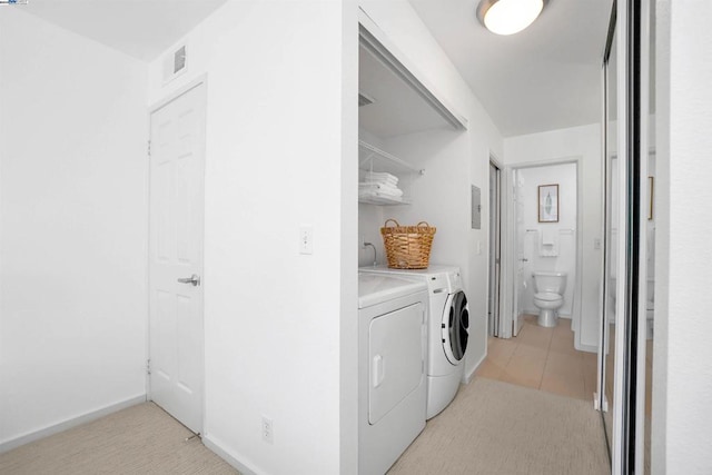 washroom featuring washing machine and clothes dryer