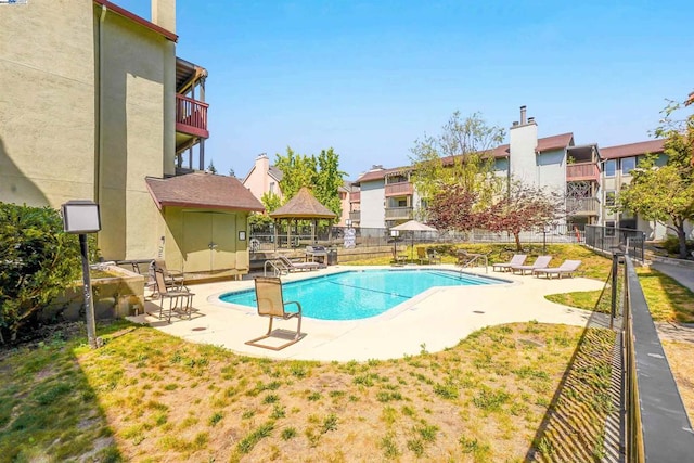 view of pool featuring a lawn, a gazebo, and a patio area