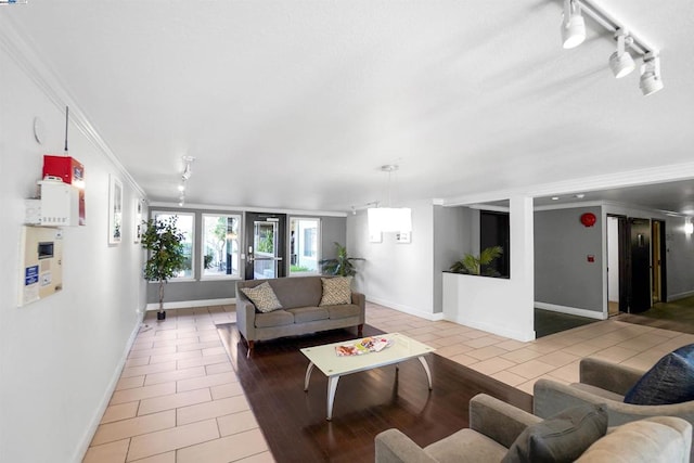 tiled living room featuring crown molding