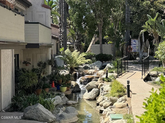 view of yard with a small pond