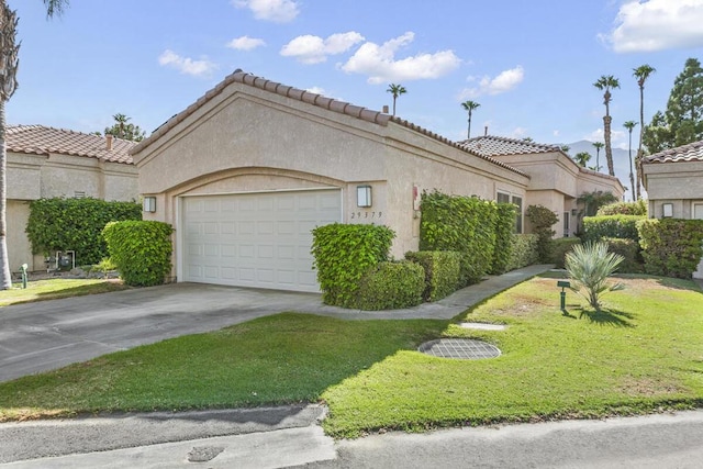 view of side of home with a lawn and a garage