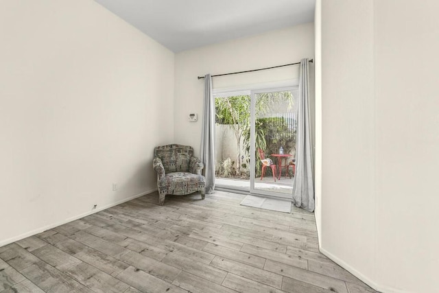 unfurnished room with light hardwood / wood-style flooring