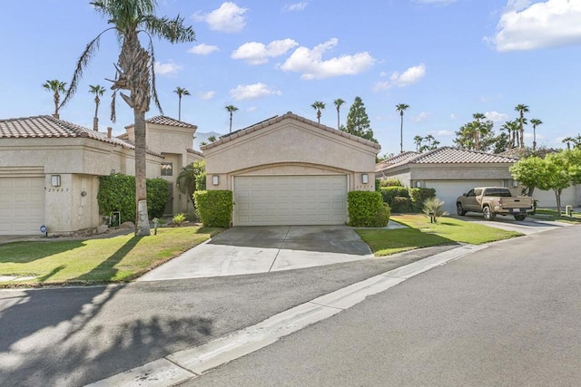 mediterranean / spanish-style house with a front yard