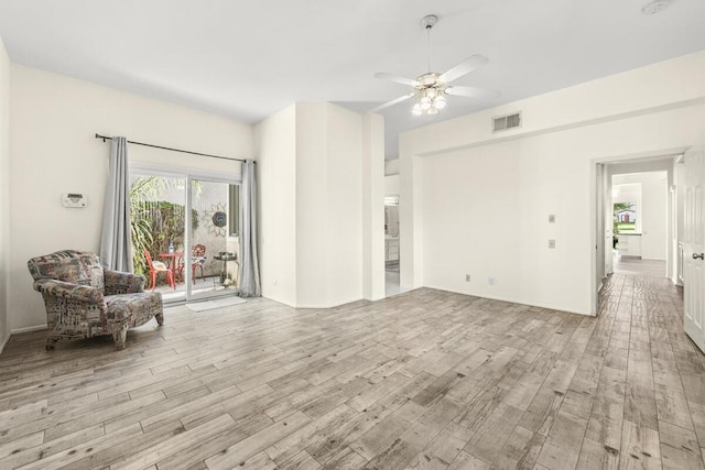 unfurnished living room with ceiling fan and light hardwood / wood-style floors