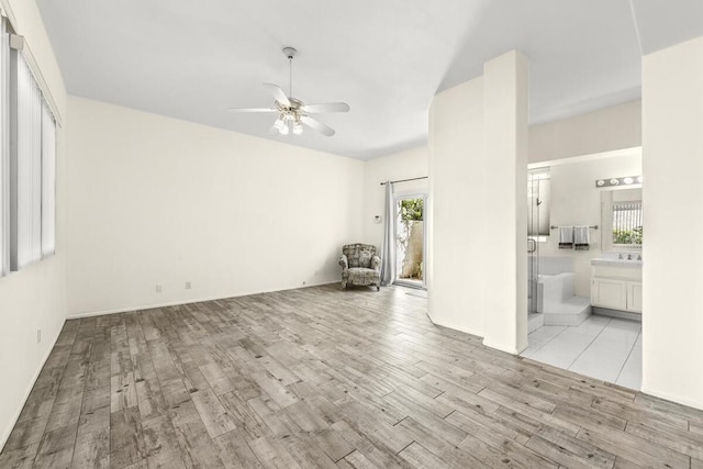 unfurnished room featuring light hardwood / wood-style flooring and ceiling fan