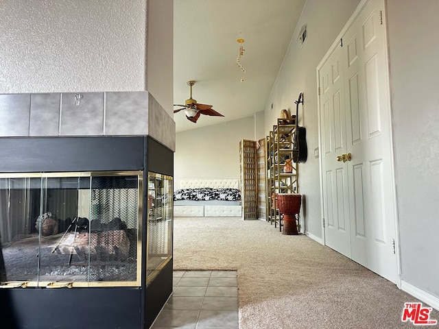 interior space with lofted ceiling and carpet flooring