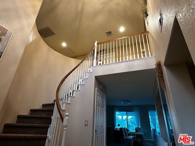 stairs with a towering ceiling