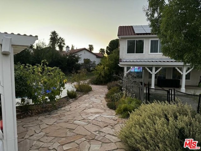 view of patio terrace at dusk