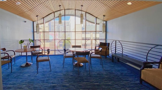 interior space with wood ceiling and lofted ceiling