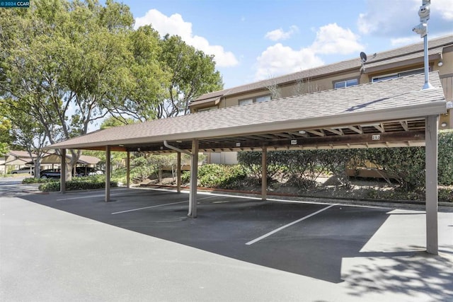 view of parking / parking lot with a carport