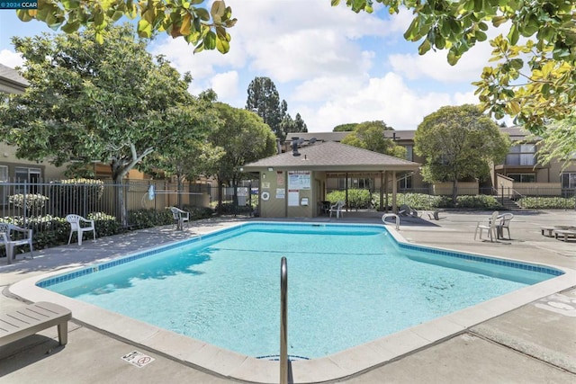 view of swimming pool with a patio area