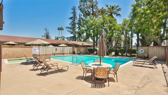 view of swimming pool featuring a patio