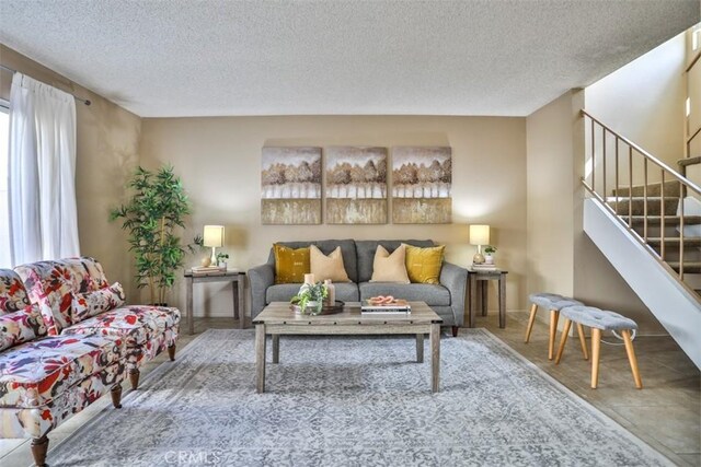 living room featuring a textured ceiling