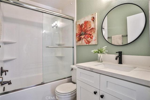 full bathroom with vanity, toilet, and bath / shower combo with glass door