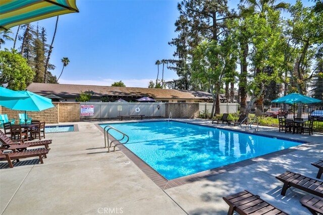 view of swimming pool featuring a patio