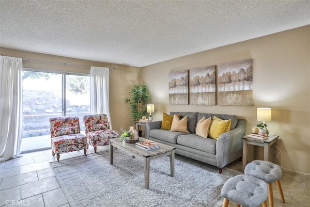 living room with light tile patterned floors and a textured ceiling