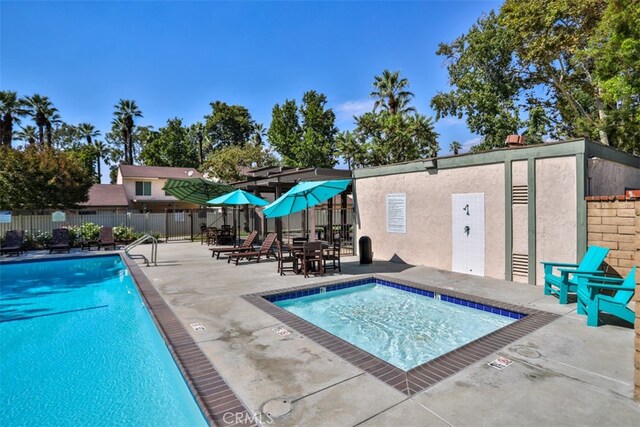 view of swimming pool featuring a patio