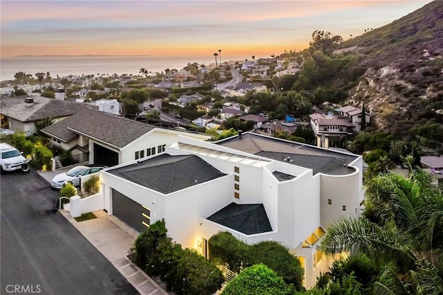 bird's eye view featuring a water view and a residential view