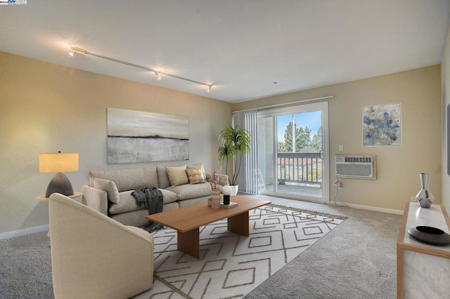 carpeted living room with track lighting and an AC wall unit