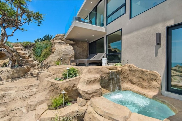 view of patio / terrace with a balcony