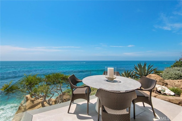 view of patio / terrace with a water view