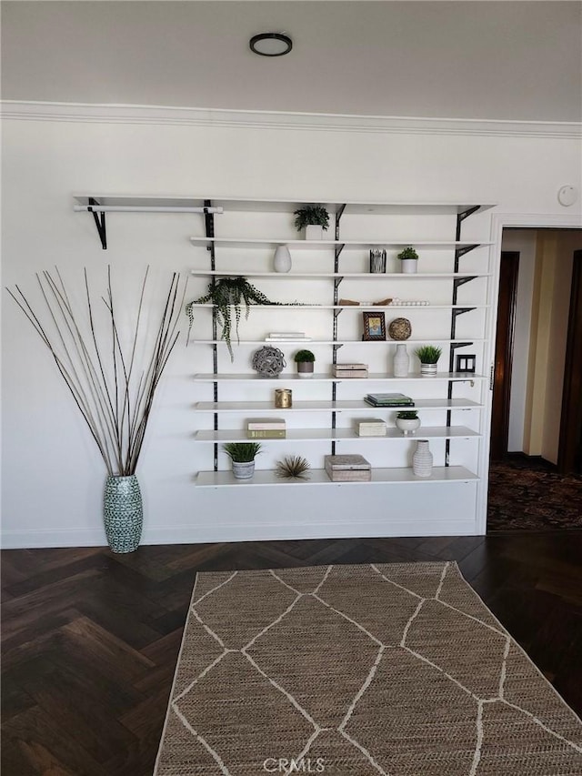 interior details with parquet flooring and ornamental molding