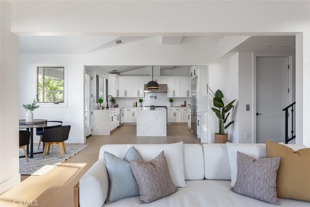 living room featuring sink