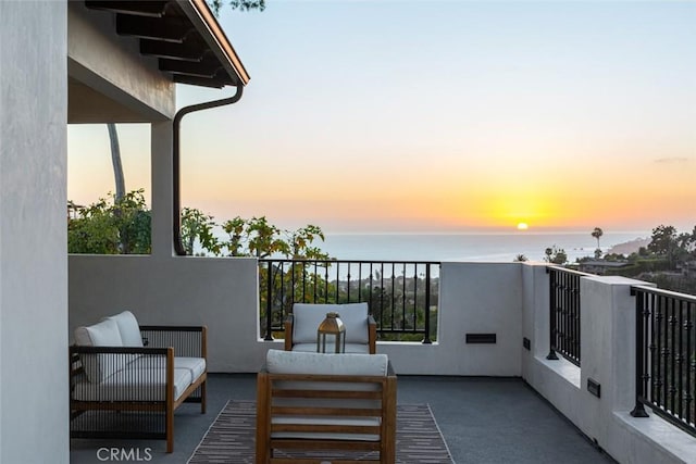 balcony at dusk with a water view