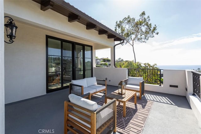 view of patio / terrace with an outdoor living space and a balcony