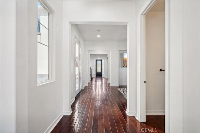 hallway with dark wood-type flooring