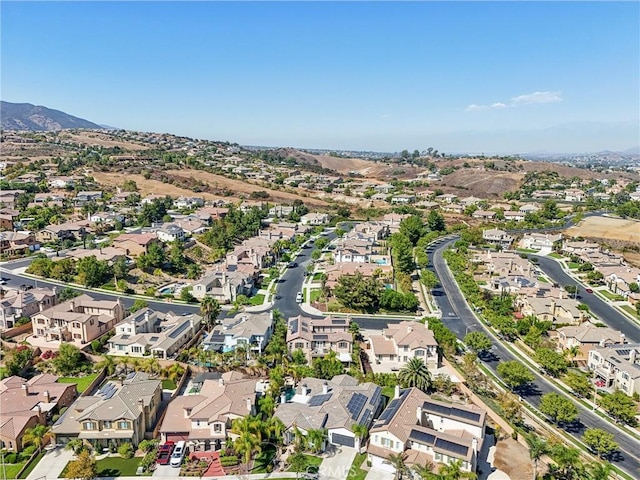 birds eye view of property featuring a mountain view