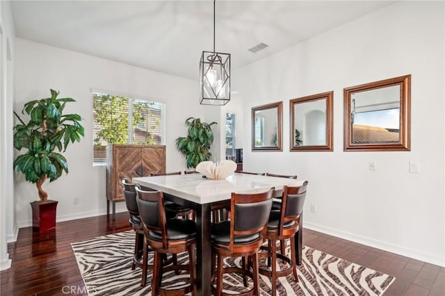 dining space featuring dark hardwood / wood-style flooring