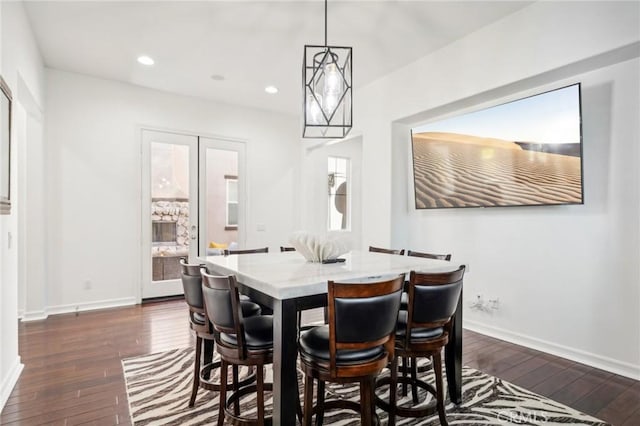 dining area with dark wood-type flooring