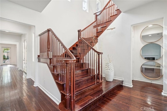 stairway featuring wood-type flooring