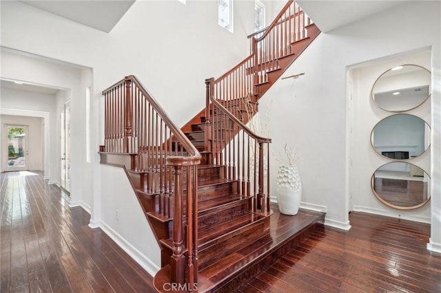 stairway featuring hardwood / wood-style flooring