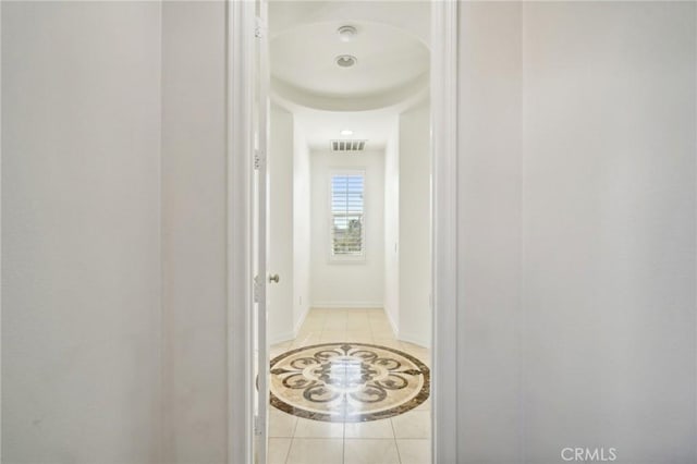 hallway with light tile patterned floors