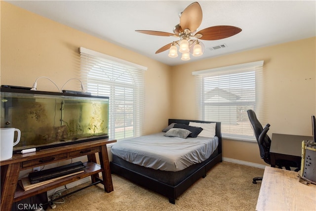 carpeted bedroom with ceiling fan