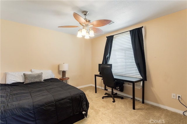 bedroom with ceiling fan and light colored carpet