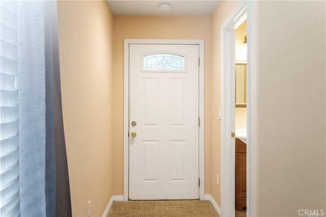 entryway with carpet flooring