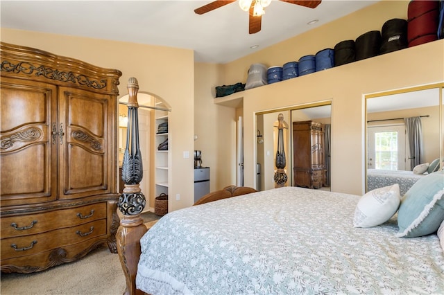 carpeted bedroom with a closet and ceiling fan