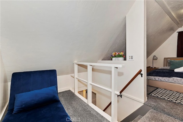 interior space with vaulted ceiling and carpet floors