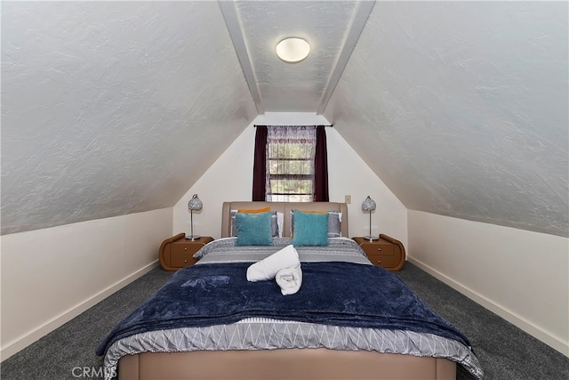 carpeted bedroom featuring a textured ceiling and vaulted ceiling