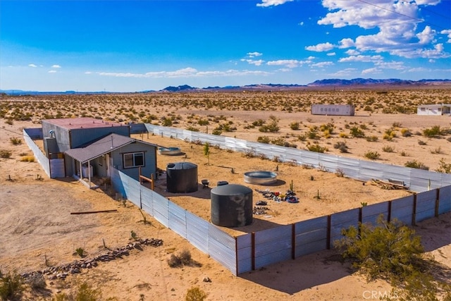 birds eye view of property with a mountain view