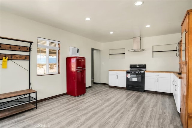 kitchen with light wood-type flooring, white cabinetry, black range with electric stovetop, and ventilation hood