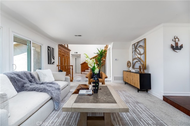 living room featuring light carpet and crown molding