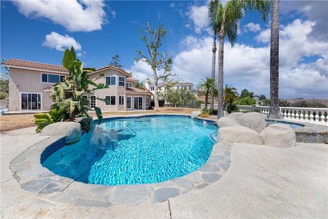 view of pool featuring a patio area