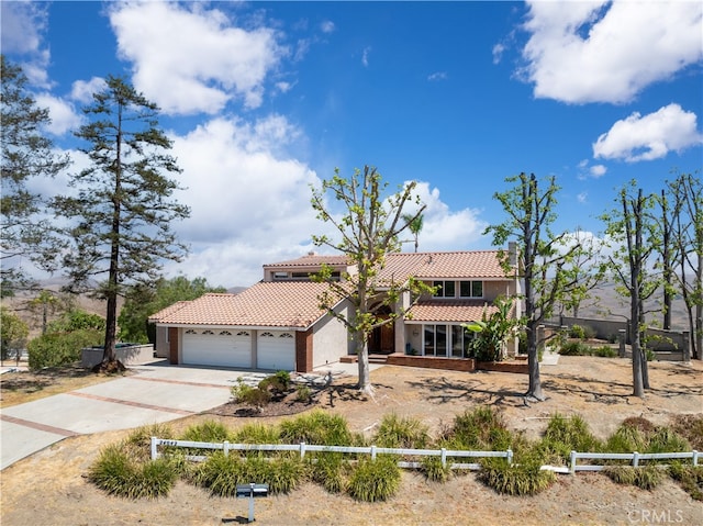 mediterranean / spanish-style house featuring a garage