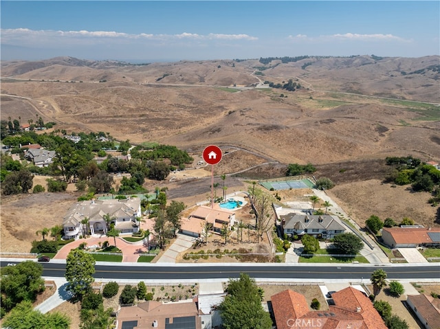 drone / aerial view featuring a mountain view