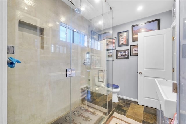 bathroom with walk in shower and toilet