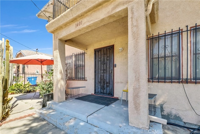 doorway to property with a patio area